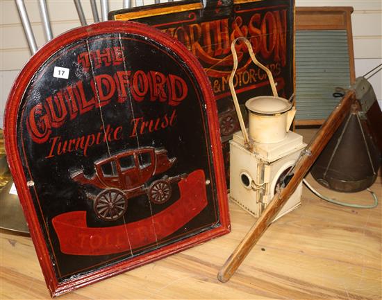 Two painted wood advertising signs, washboard, sieve, starboard lamp and a rudder